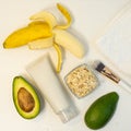 Banana and avocado for a handmade face mask and ingredients on a white table. Skin care.