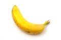 Banana with black spots isolated on white background. Overripe banana