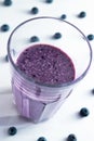 banana and blueberry smoothie in a glass cup with blueberries Royalty Free Stock Photo