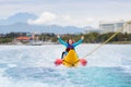 Banana boat ride. Kids on the beach Royalty Free Stock Photo