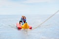 Banana boat ride. Kids on the beach Royalty Free Stock Photo