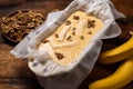 Banana bread. Cooking. Vegetarian food. Raw muffin with bananas and nuts on a wooden background Royalty Free Stock Photo