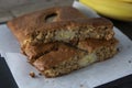 Banana bread with oat flour. Top view of homemade banana bread on wooden background. Ideas and recipes for healthy diet breakfast Royalty Free Stock Photo