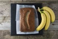 Banana bread with oat flour. Top view of homemade banana bread on wooden background. Ideas and recipes for healthy diet breakfast Royalty Free Stock Photo