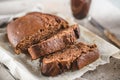 Banana bread sliced with coffee. Vegan pasrty. Home bakery concept. Close-up