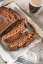 Banana bread sliced with coffee. Vegan pasrty. Home bakery concept. Close-up