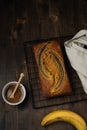 Banana bread top view on dark rustic wooden table