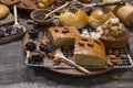 The bakery set consists of banana cake with almond topping, and bread sprinkled with black sesame seeds. Placed on a steel grid, D Royalty Free Stock Photo