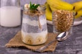 Banana chia pudding with granola in a jar.