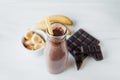 Banana and chocolate smoothie in the glass jar milkshakes, natural and organic drink Royalty Free Stock Photo