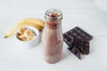 Banana and chocolate smoothie in the glass jar milkshakes, natural and organic drink Royalty Free Stock Photo