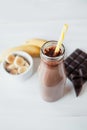 Banana and chocolate smoothie in the glass jar milkshakes, natural and organic drink Royalty Free Stock Photo