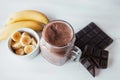 Banana and chocolate smoothie in the glass jar milkshakes, natural and organic drink Royalty Free Stock Photo