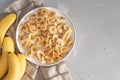 Banana - This is a close up shot of a bowl full of dried banana chips. Shot with a shallow depth of field and vignetting Royalty Free Stock Photo