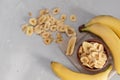 Banana - This is a close up shot of a bowl full of dried banana chips. Shot with a shallow depth of field and vignetting Royalty Free Stock Photo