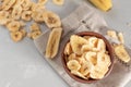 Banana - This is a close up shot of a bowl full of dried banana chips. Shot with a shallow depth of field and vignetting Royalty Free Stock Photo