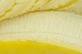 Banana closeup showing endocarp edible part and peeled back skin