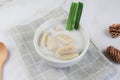 Banana in coconut milk or Kluay Buad Chee with pandan leaf in white bowl. Popular food Thai Royalty Free Stock Photo