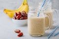 Banana and date fruit smoothie or milkshake in glass mason jar