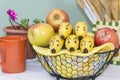 Banana Faces Peer from Fruit Basket