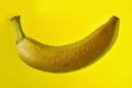 Banana falling in the water with drops on yellow