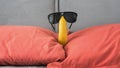 Funny banana in sunglasses on a bed in a hotel apartment,close-up Royalty Free Stock Photo