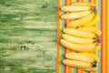Banana on a green chalkboard on colored napkin left space for te