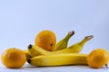 Banana and group of tangerines, mandarins isolated over white Royalty Free Stock Photo