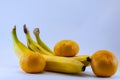 Banana and group of tangerines, mandarins isolated over white Royalty Free Stock Photo