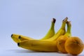 Banana and group of tangerines, mandarins isolated over white Royalty Free Stock Photo