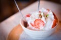 Banana ice cream with strawberry and mint in cup Royalty Free Stock Photo