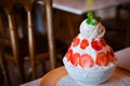 Banana ice cream with strawberry and mint in cup. Royalty Free Stock Photo