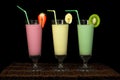 Banana, kiwi and strawberry milk shake and fresh fruis Royalty Free Stock Photo