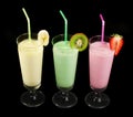 Banana, kiwi and strawberry milk shake and fresh fruis Royalty Free Stock Photo