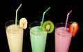 Banana, kiwi and strawberry milk shake and fresh fruis Royalty Free Stock Photo