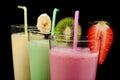 Banana, kiwi and strawberry milk shake and fresh fruis Royalty Free Stock Photo