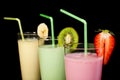 Banana, kiwi and strawberry milk shake and fresh fruis Royalty Free Stock Photo