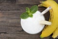 Banana mixed coconut smoothie white fruit juice milkshake blend beverage healthy. Royalty Free Stock Photo