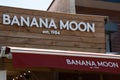 Banana moon logo sign and brand text on store facade clothing shop entrance