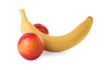 Banana and nectarines symbolizing male genitals on white background. Potency concept