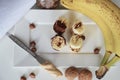 Banana, nuts, chocolate, walnuts. Healthy diet meal. Banana sweet. Royalty Free Stock Photo