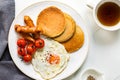 Banana Oat Pancakes with Fried egg, Sausages and Cherry Tomatoes Royalty Free Stock Photo