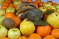 banana, orange, quince, apple, tangerine, kiwi are mixed tasty fruit composition on background.