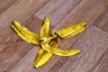 Banana peel lies on the floor.