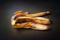 Banana peel. Peel of a bunch of overripe banana on a dark colored background close-up