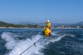 Tourists have fun on the banana. Royalty Free Stock Photo