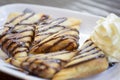 Banana samosas topped with chocolate