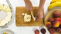 Banana Slices on a Chopping Board Close Up on White Background, Woman Hands. Fresh Fruit Platter Royalty Free Stock Photo