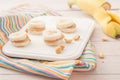 Banana slices with peanut butter on white board Royalty Free Stock Photo