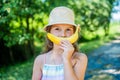 Banana smile. Funny baby on natural landscape. Teeth health. Tooth filling. Dental care. Oral hygiene. Healthy gums